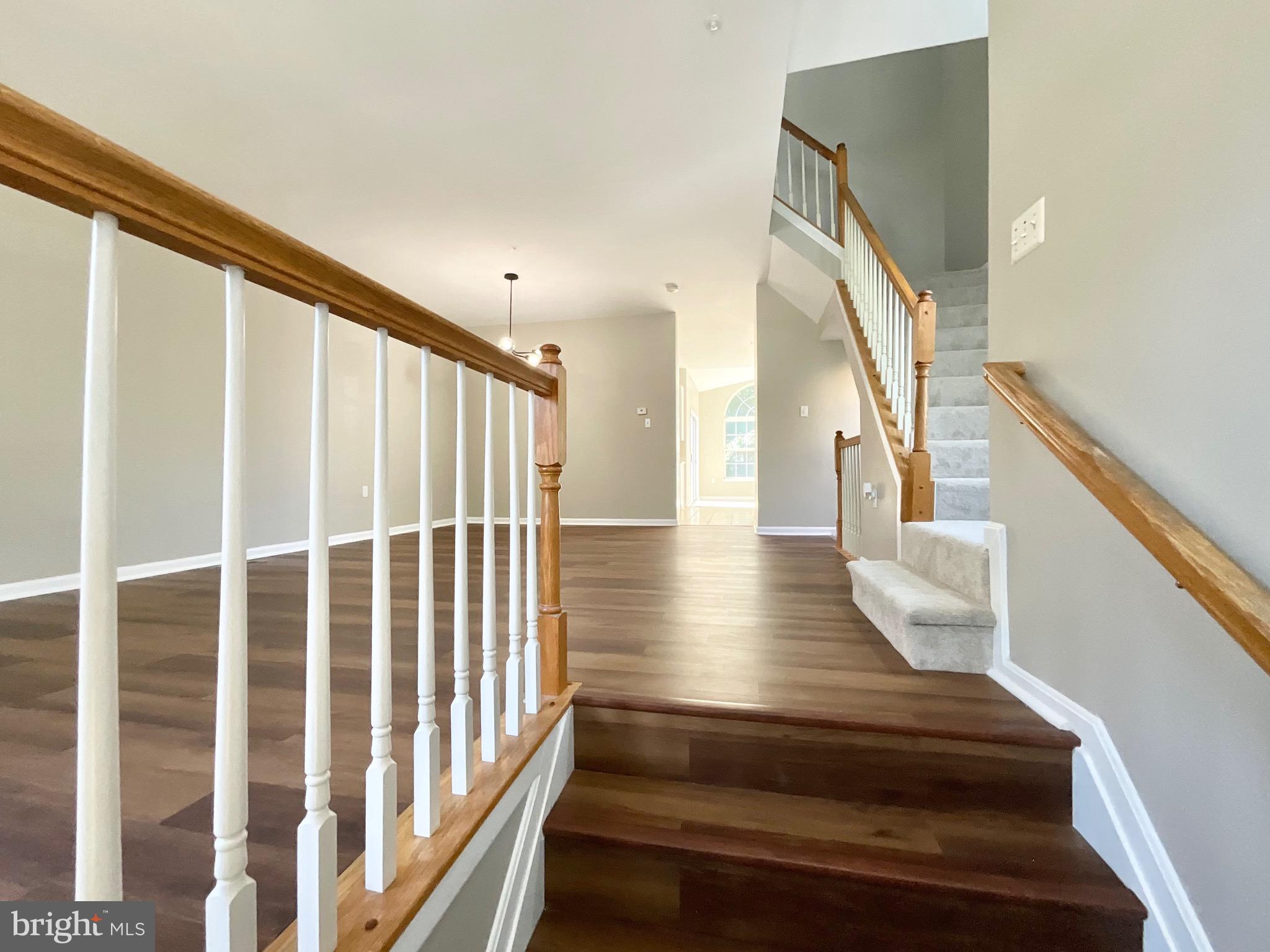 4308 Huntshire Road Randallstown, MD 21133 - Photo 16 of 40 a view of entryway and hall with wooden floor