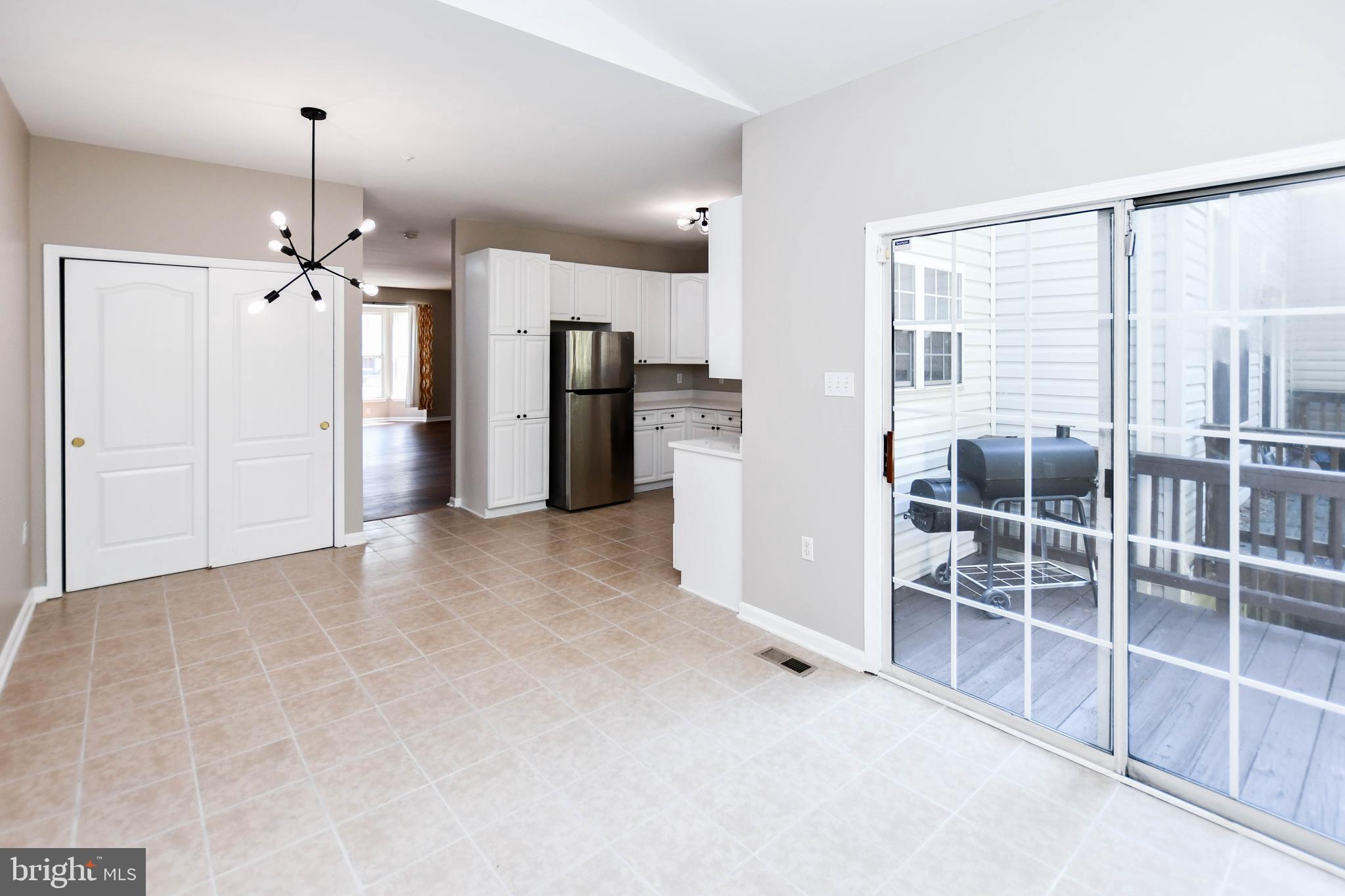 4308 Huntshire Road Randallstown, MD 21133 - Photo 18 of 40 a view of a kitchen with refrigerator and windows