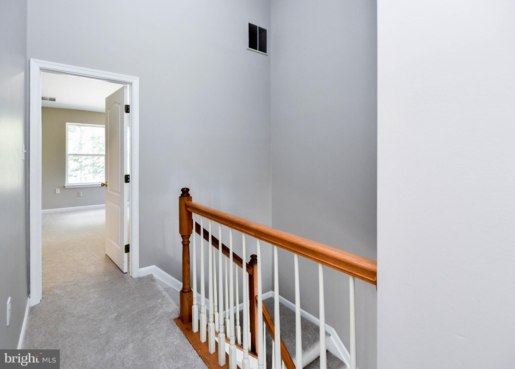 4308 Huntshire Road Randallstown, MD 21133 - Photo 20 of 40 a view of a hallway with wooden floor and entryway