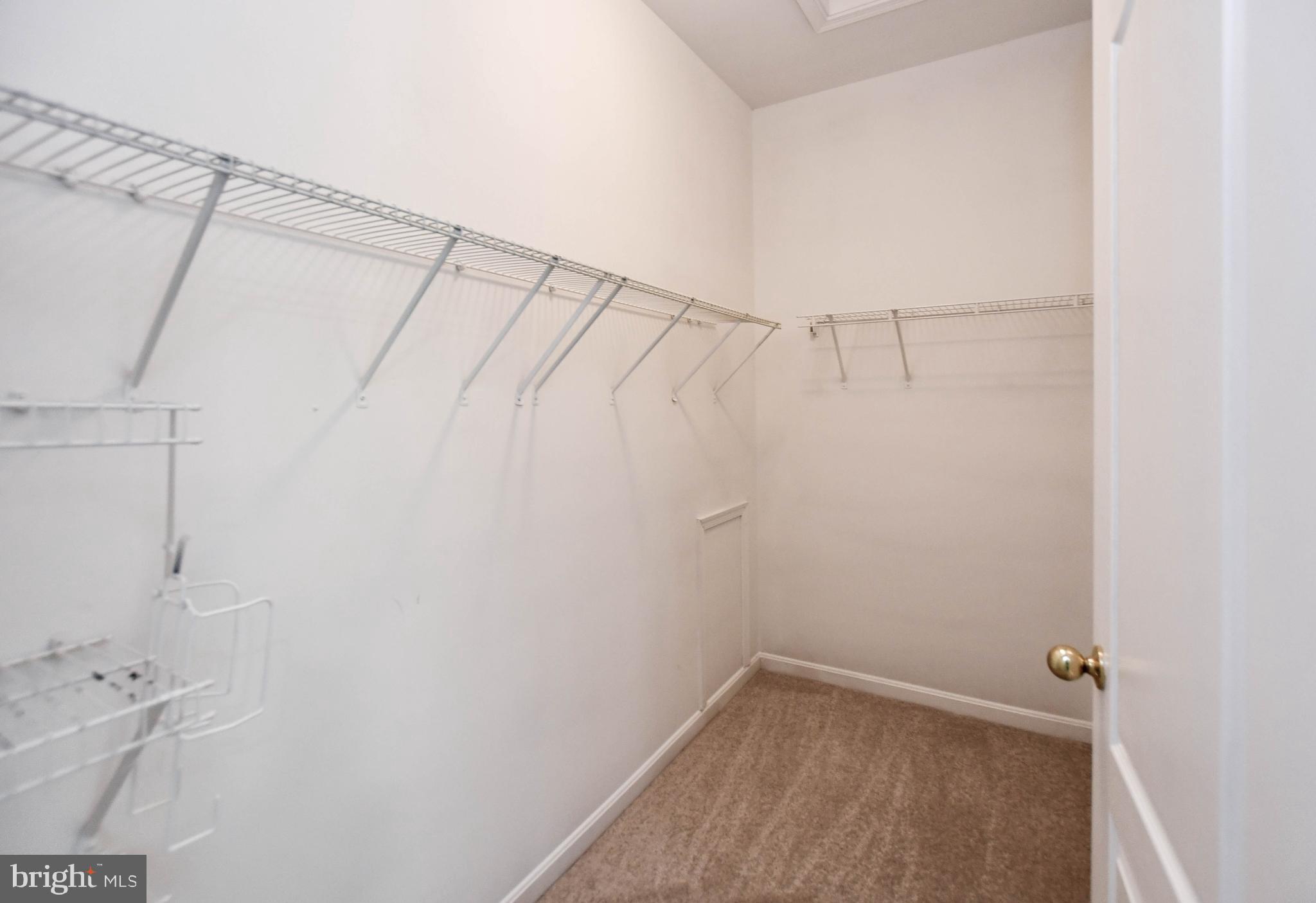 4308 Huntshire Road Randallstown, MD 21133 - Photo 25 of 40 a view of a room with racks on the wall