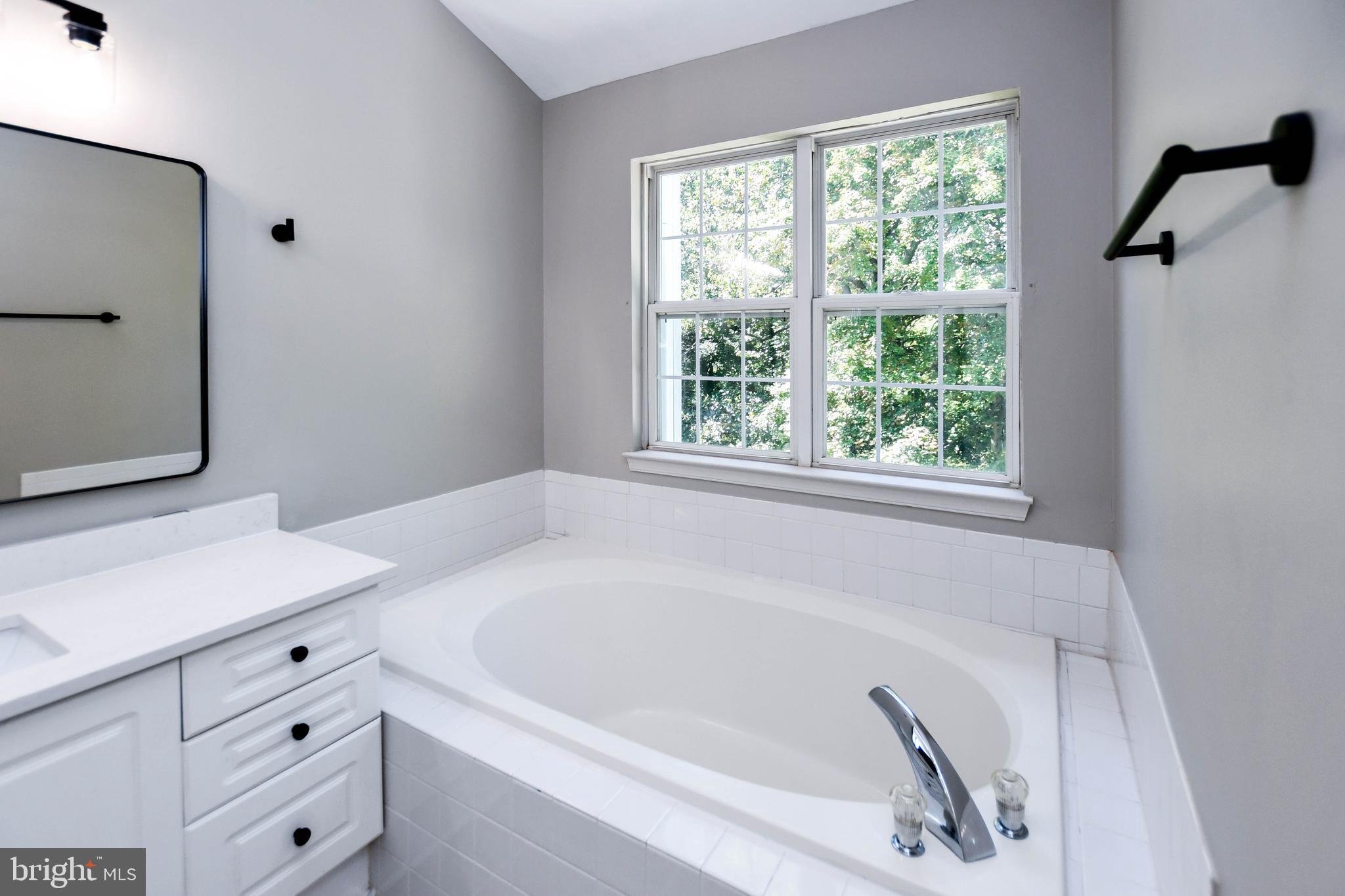 4308 Huntshire Road Randallstown, MD 21133 - Photo 27 of 40 a bathroom with a bathtub and a sink