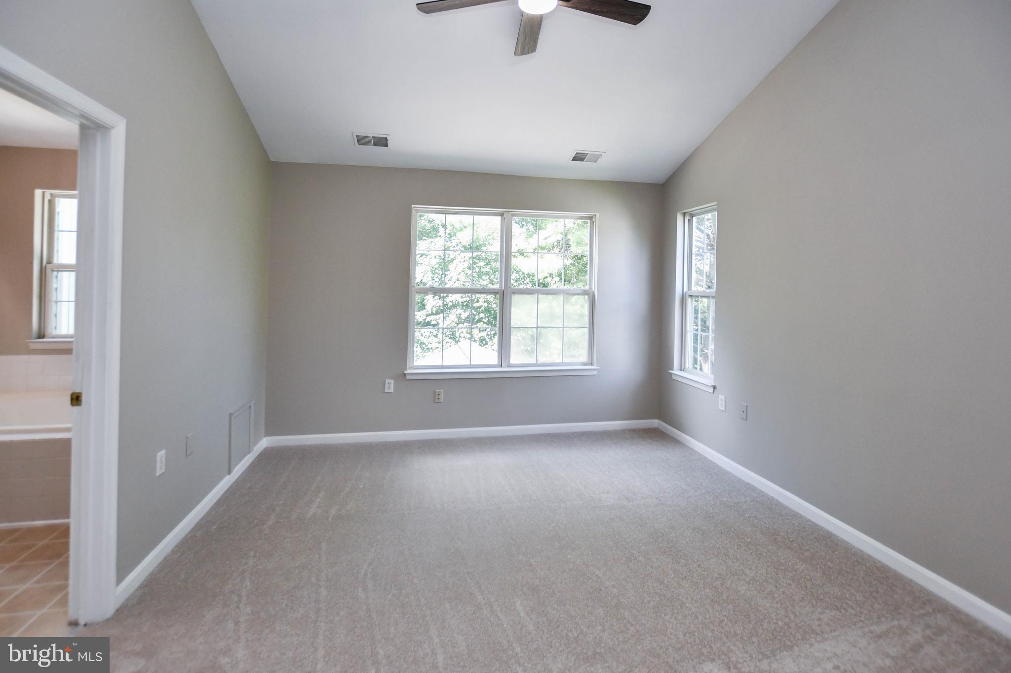 4308 Huntshire Road Randallstown, MD 21133 - Photo 32 of 40 a view of an empty room with a window