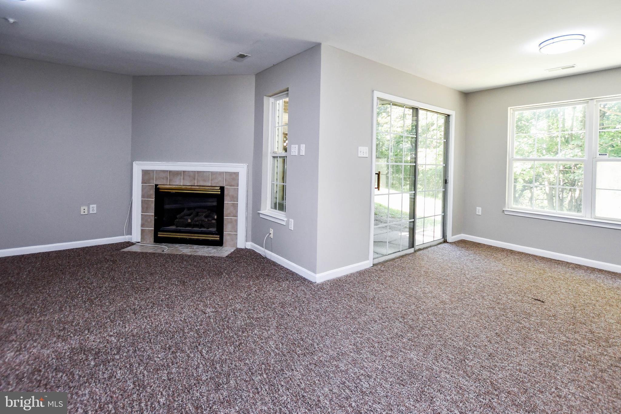 4308 Huntshire Road Randallstown, MD 21133 - Photo 36 of 40 a view of empty room with a fireplace