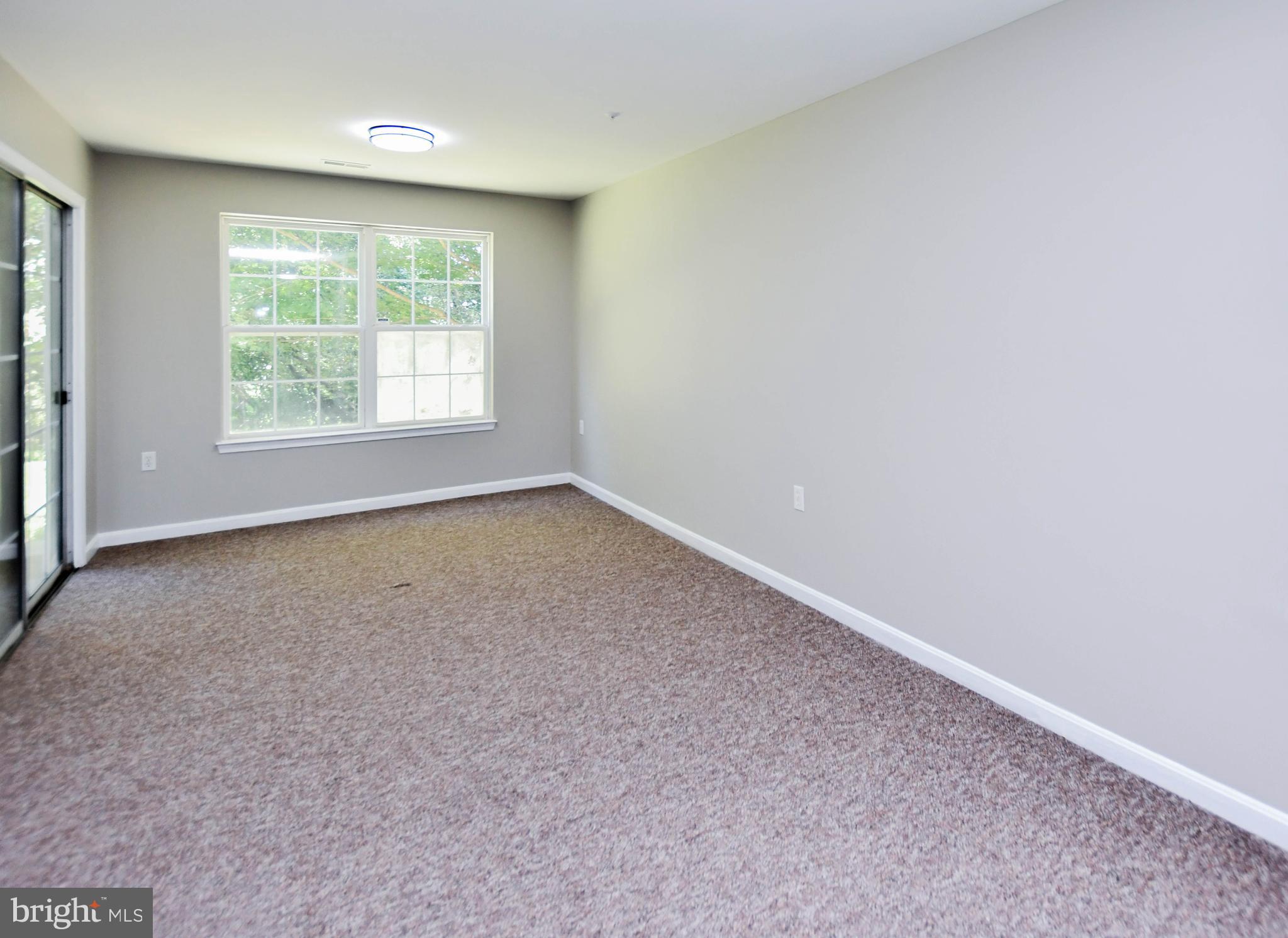 4308 Huntshire Road Randallstown, MD 21133 - Photo 39 of 40 an empty room with a window
