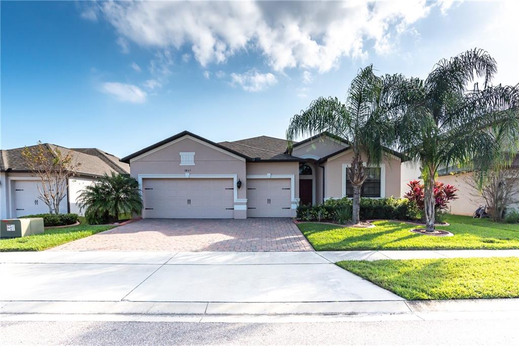 2865 Spring Breeze Way Kissimmee, FL 34744 - Photo 1 of 1 a front view of a house with garden