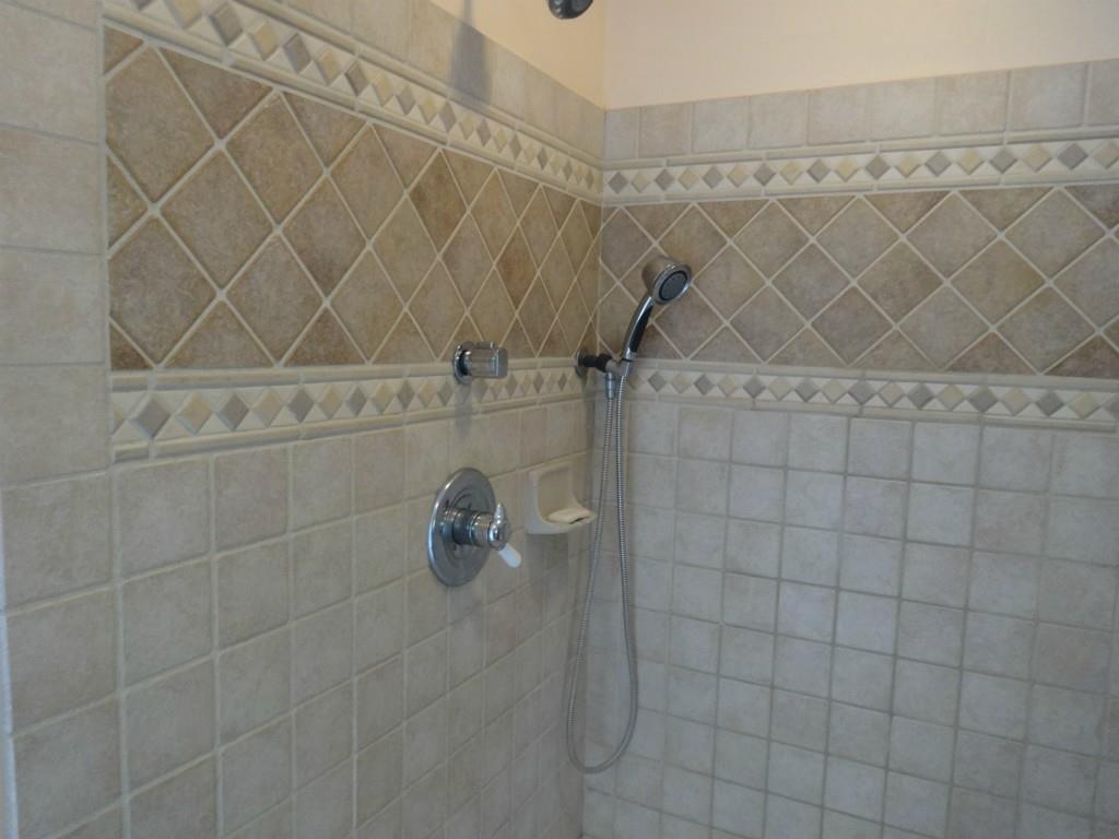 83 Lake Shore Road Holden, ME 04429 - Photo 20 of 35 Beautifully tiled shower
