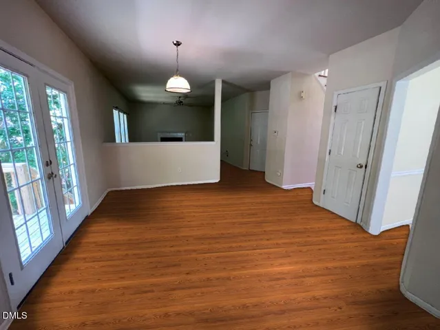 a view of a room with window and wooden floor