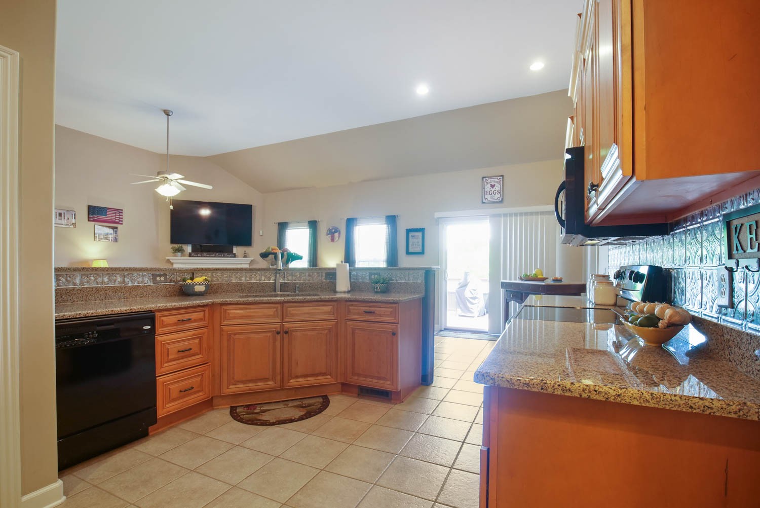 545 Sugar Flat Road Lebanon, TN 37087 - Photo 11 of 26 a large kitchen with granite countertop a large stove a sink and a microwave