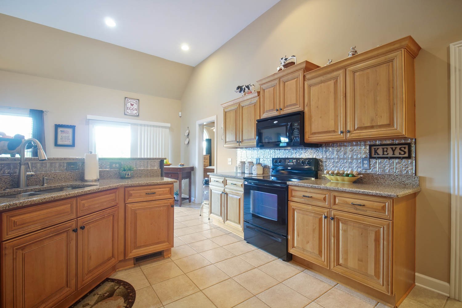 545 Sugar Flat Road Lebanon, TN 37087 - Photo 12 of 26 a kitchen with stainless steel appliances granite countertop a stove sink and cabinets