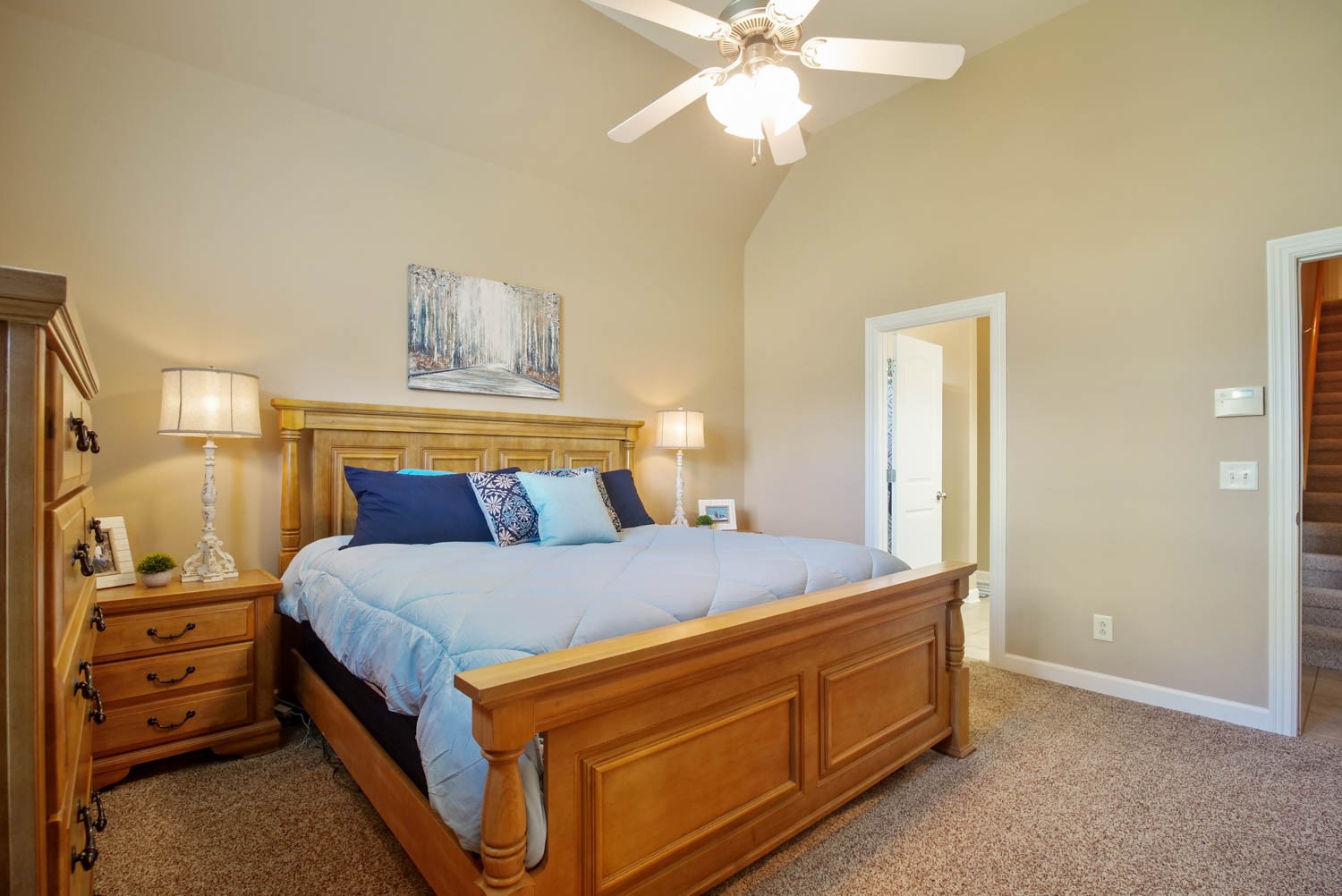 545 Sugar Flat Road Lebanon, TN 37087 - Photo 15 of 26 a bedroom with a bed and a chandelier