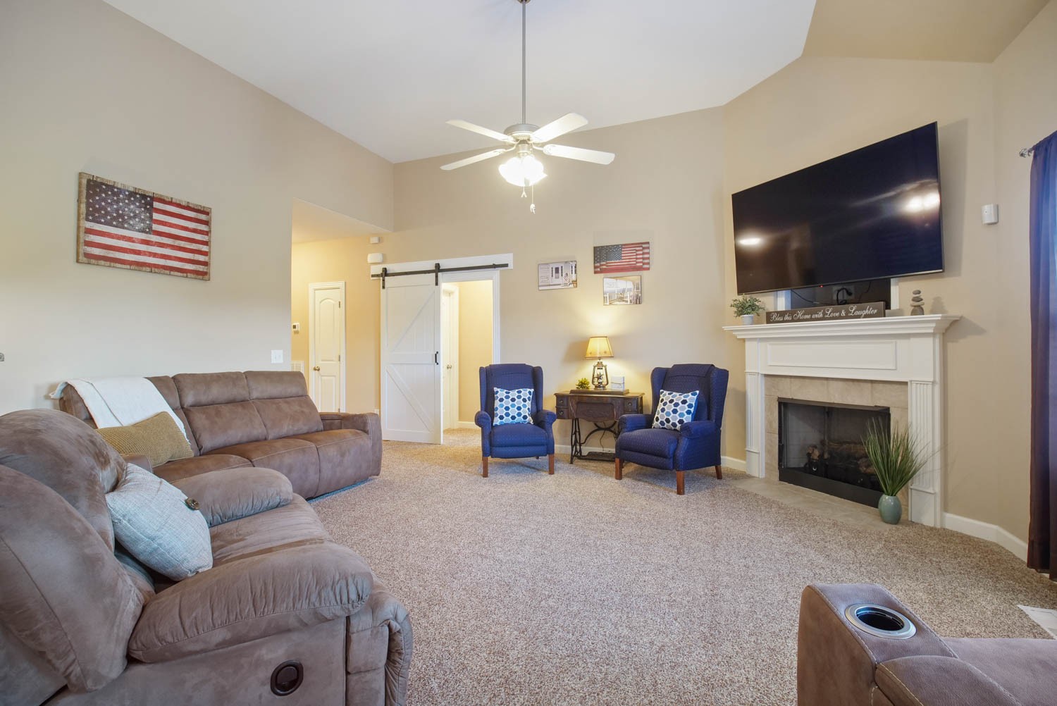 545 Sugar Flat Road Lebanon, TN 37087 - Photo 6 of 26 a living room with furniture a flat screen tv and a fireplace