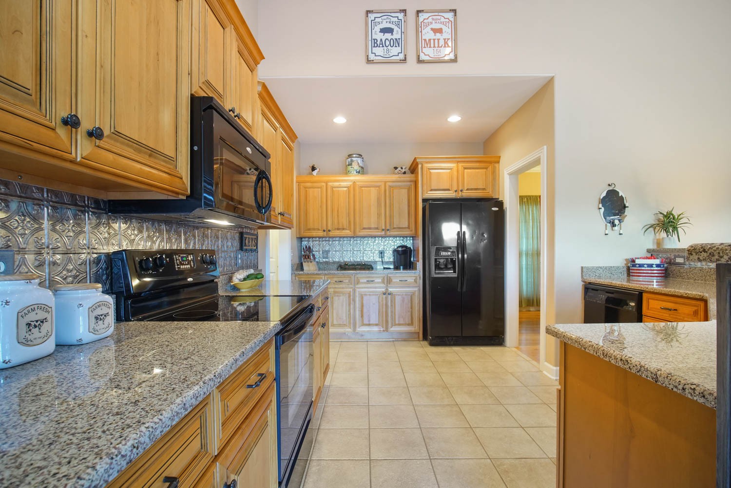 545 Sugar Flat Road Lebanon, TN 37087 - Photo 10 of 26 a kitchen with stainless steel appliances granite countertop a sink a stove and a refrigerator