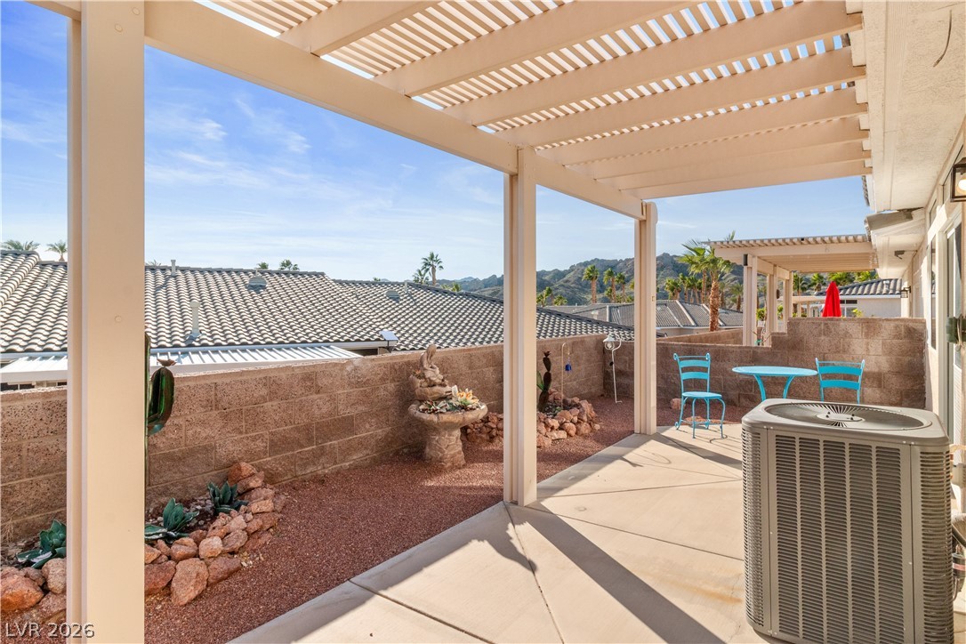 3350 Pheasant Canyon Way, Unit 1008 Laughlin, NV 89029 - Photo 49 of 80 Fenced backyard featuring a patio area and a pergola