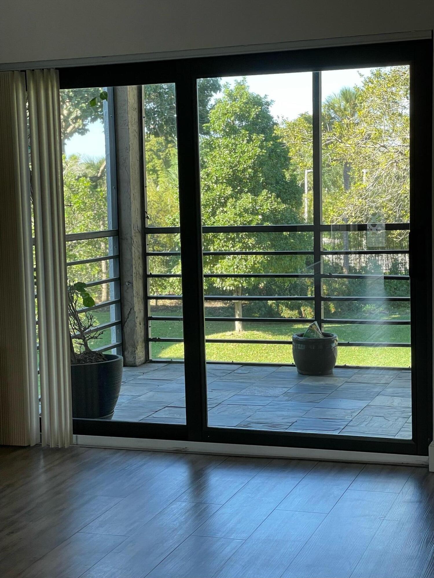 9235 Southwest 8th Street, Unit 307 Boca Raton, FL 33428 - Photo 32 of 44 Screened Balcony