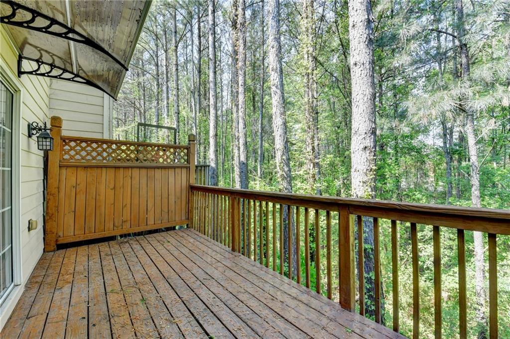 3977 Howell Park Road Duluth, GA 30096 - Photo 25 of 25 a view of a wooden balcony with trees