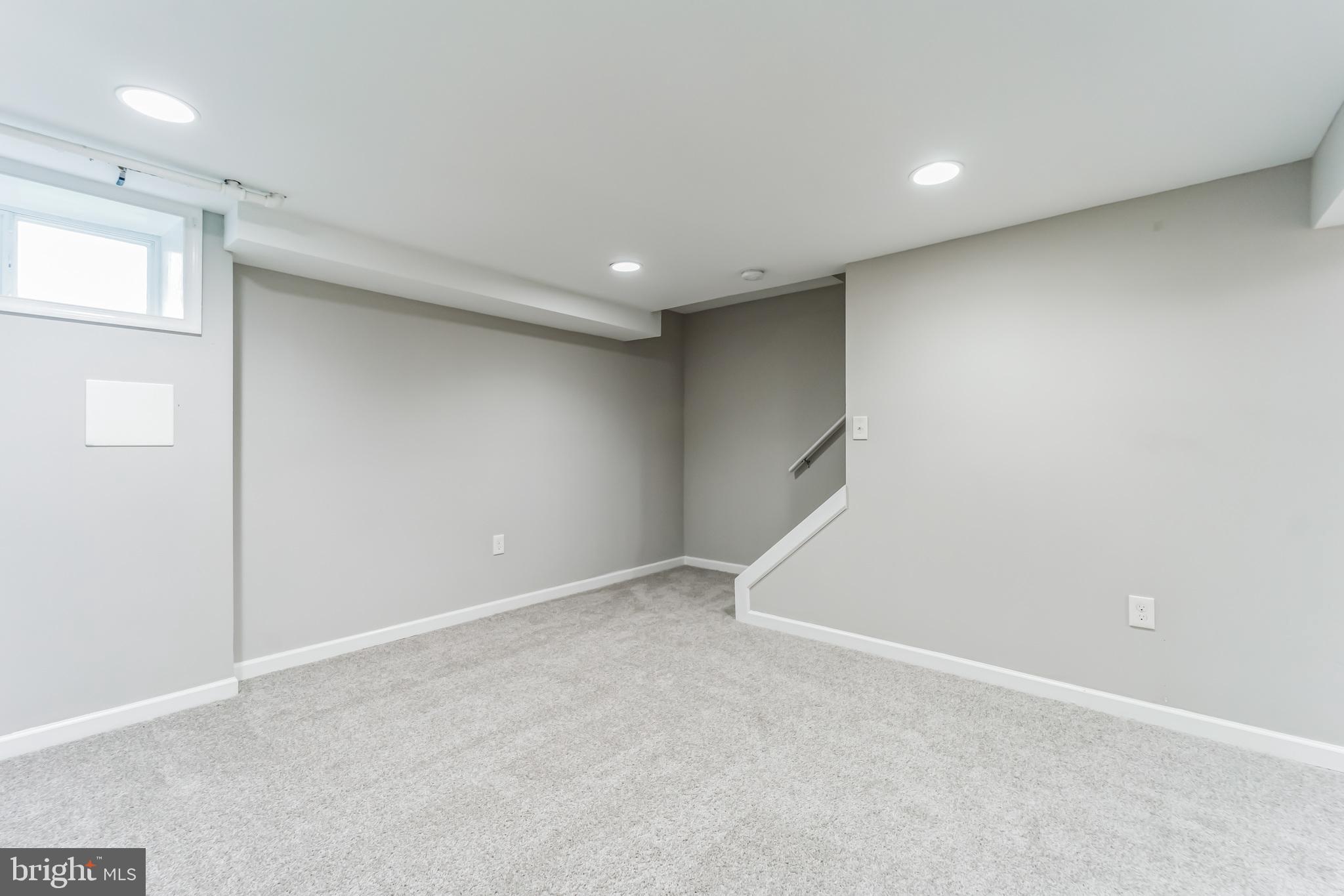 3422 Dunran Road Dundalk, MD 21222 - Photo 20 of 30 an empty room with staircase and white walls