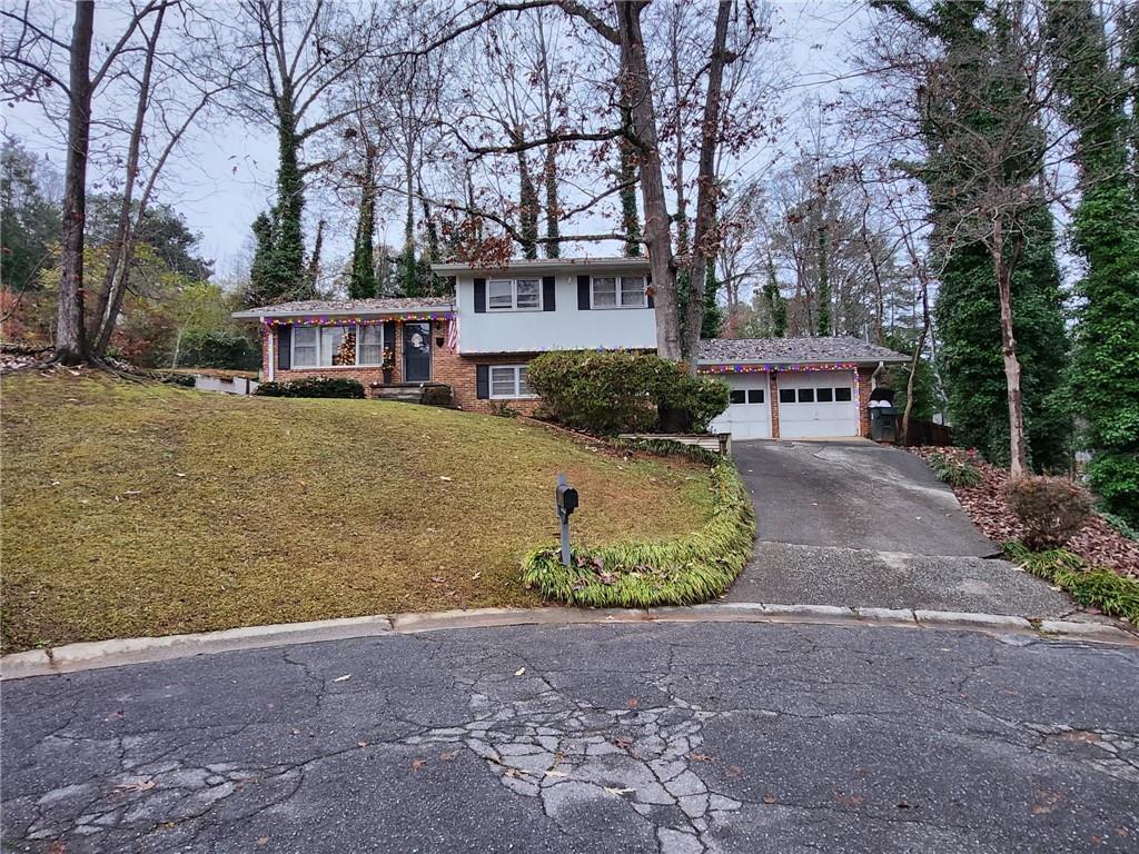 90 Elm Drive Toccoa, GA 30577 - Photo 1 of 1 a front view of a house with a yard and trees