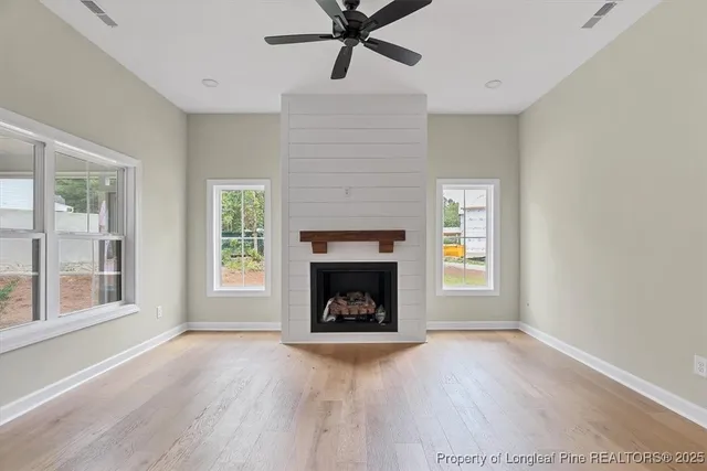 a living room with fireplace and a fireplace