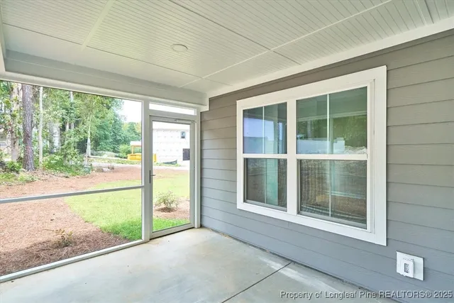 a view of an empty room with a large window