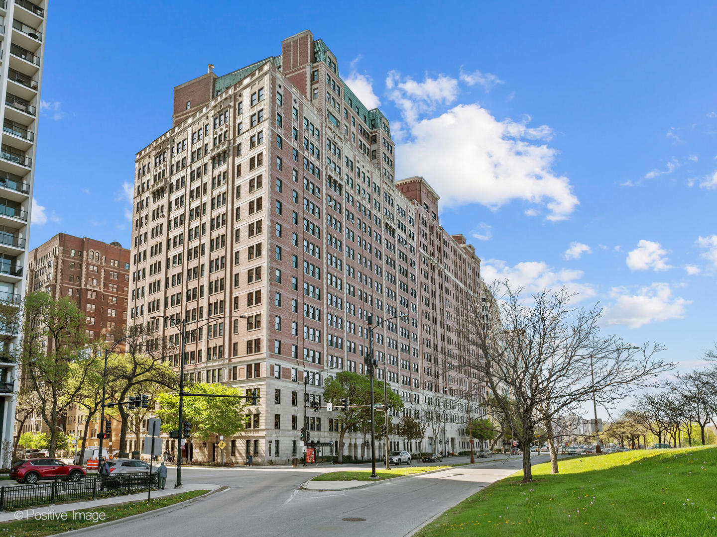 3240 North Lake Shore Drive, Unit 11B Chicago, IL 60657 - Photo 1 of 25 a view of a tall building next to a yard