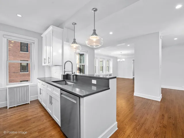 a kitchen with sink and window