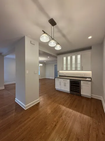 a room with furniture and wooden floor