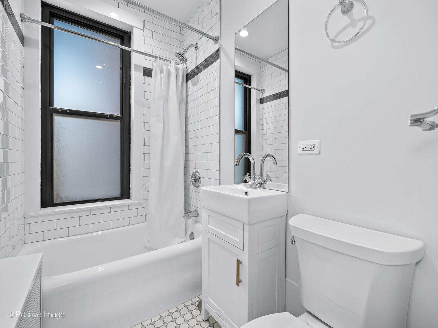3240 North Lake Shore Drive, Unit 11B Chicago, IL 60657 - Photo 22 of 25 a bathroom with a sink a toilet and a bathtub