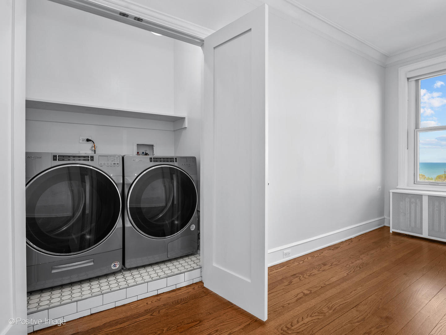 3240 North Lake Shore Drive, Unit 11B Chicago, IL 60657 - Photo 23 of 25 a utility room with sink dryer and washer