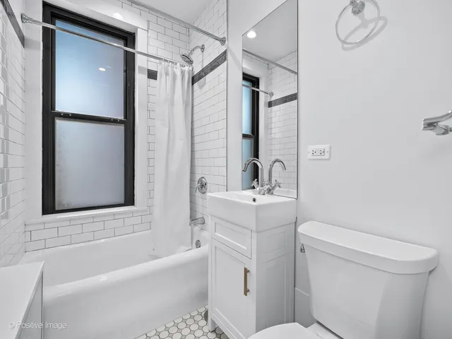 a bathroom with a sink a toilet and a bathtub