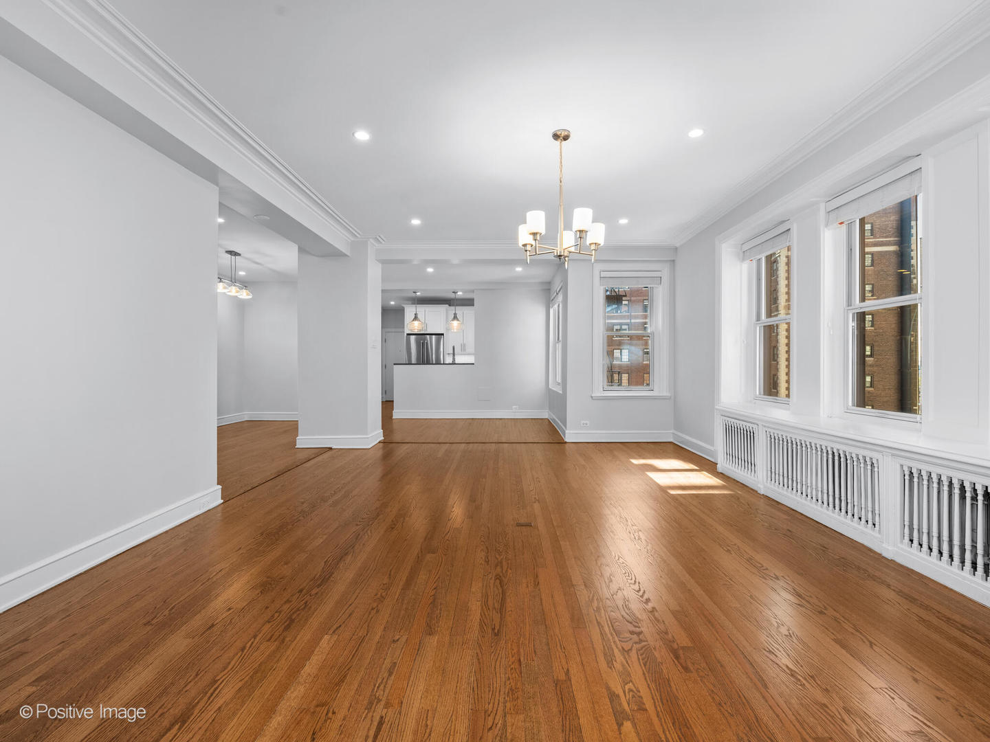 3240 North Lake Shore Drive, Unit 11B Chicago, IL 60657 - Photo 7 of 25 a view of livingroom with kitchen and hardwood