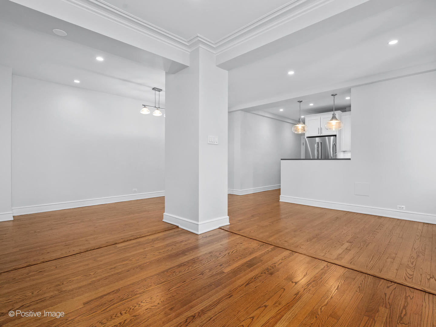 3240 North Lake Shore Drive, Unit 11B Chicago, IL 60657 - Photo 9 of 25 an empty room with wooden floor and windows
