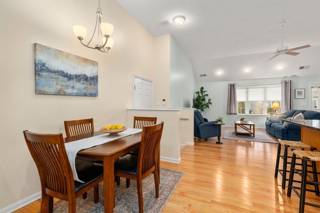 42 Brewster Road, Unit 42 Stoughton, MA 02072 - Photo 22 of 29 a view of a dining room with furniture and wooden floor