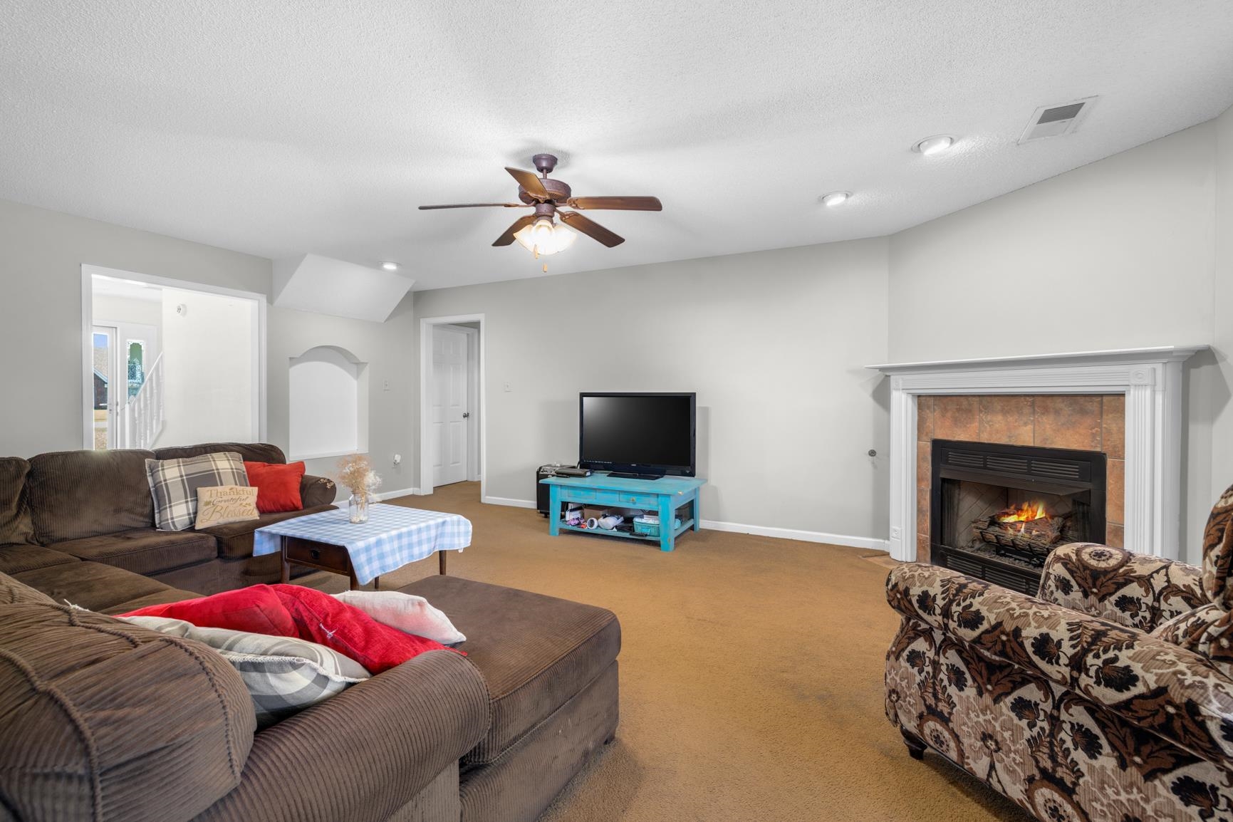 538 Rosemark Road Atoka, TN 38004 - Photo 11 of 25 a living room with furniture and a fireplace