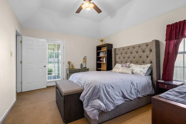 a bathroom with a toilet a sink and a large mirror