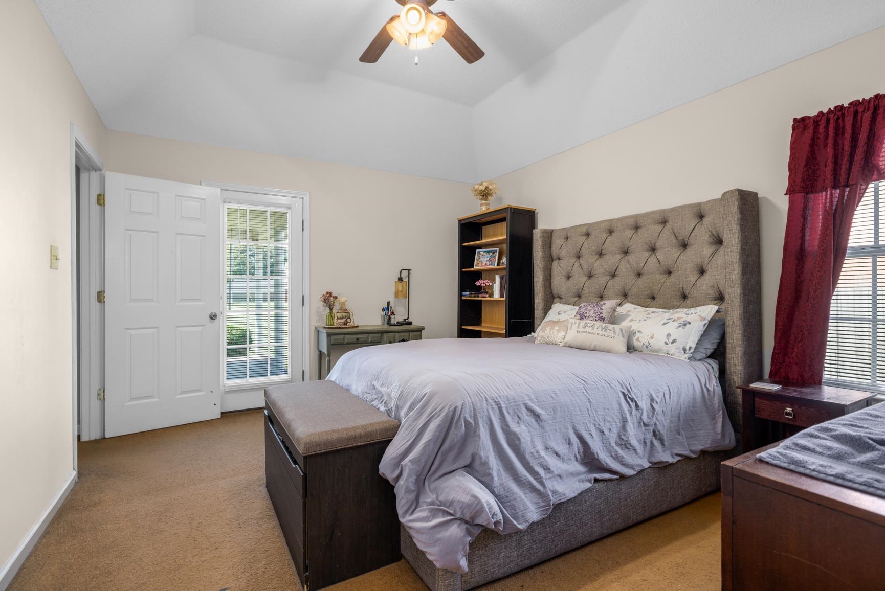 538 Rosemark Road Atoka, TN 38004 - Photo 17 of 25 a bedroom with a large bed and a chandelier