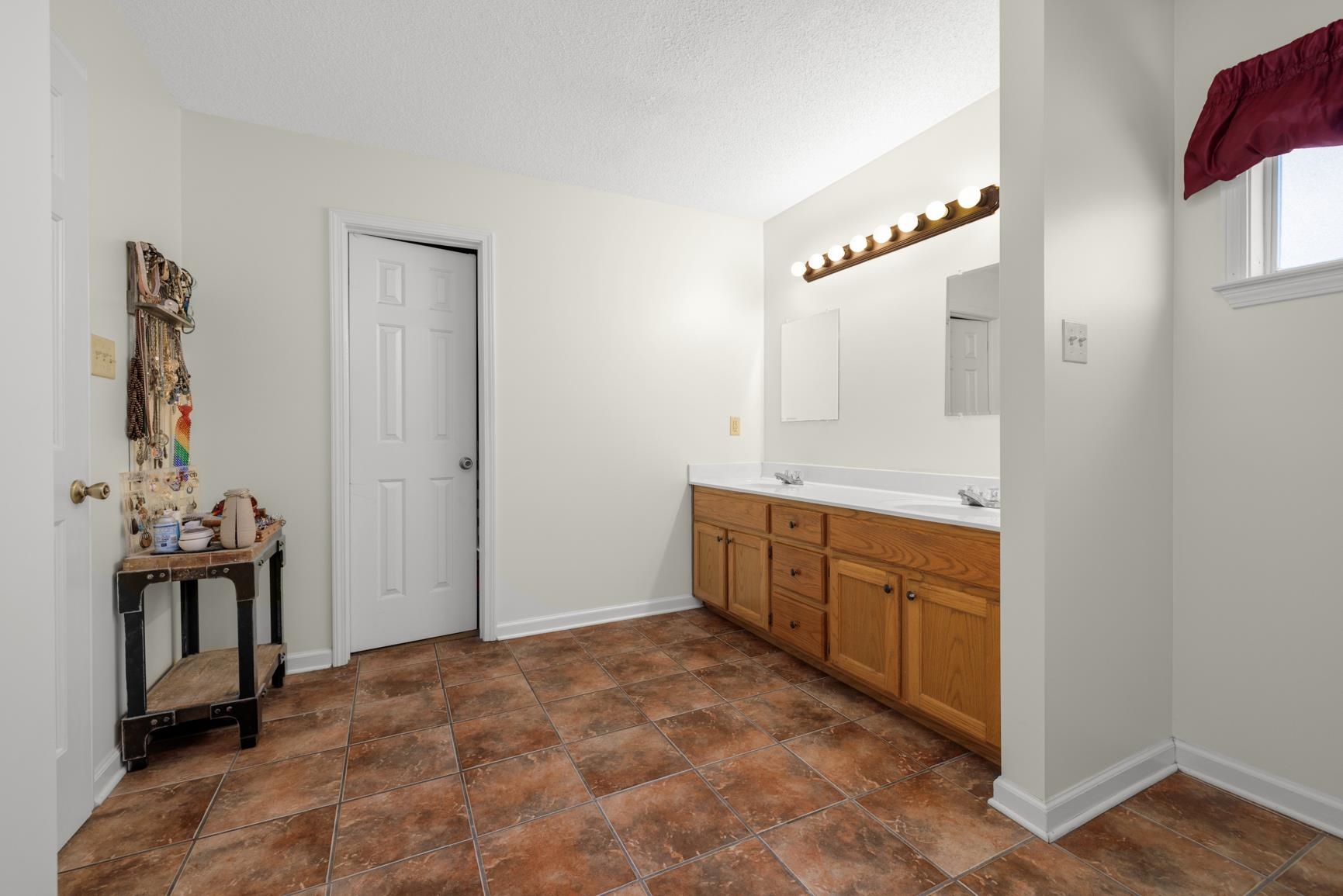 538 Rosemark Road Atoka, TN 38004 - Photo 19 of 25 a spacious bathroom with a double vanity sink and a mirror