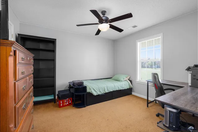 a view of room with workspace and a window