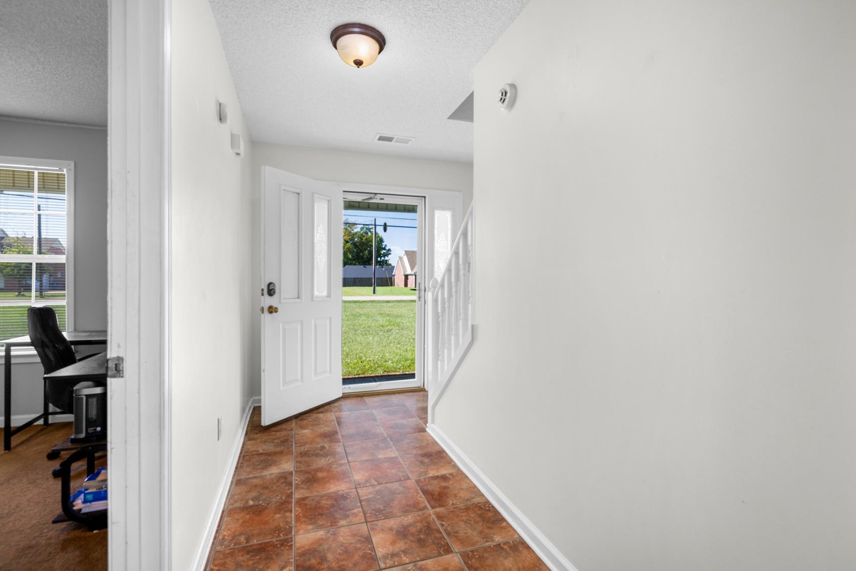 538 Rosemark Road Atoka, TN 38004 - Photo 9 of 25 a view of a hallway with a livingroom and a livingroom with furniture