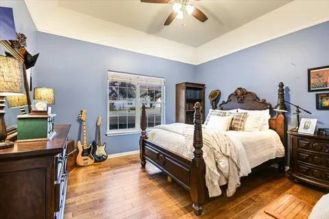 a large bathroom with a double vanity sink large mirror and a bathtub