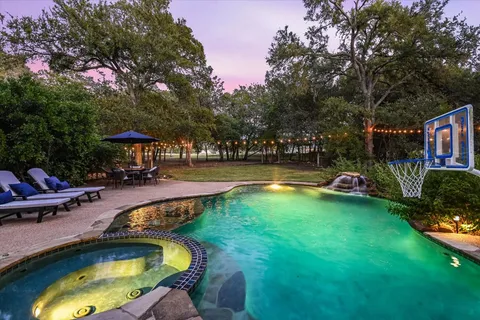 a view of a swimming pool with a garden