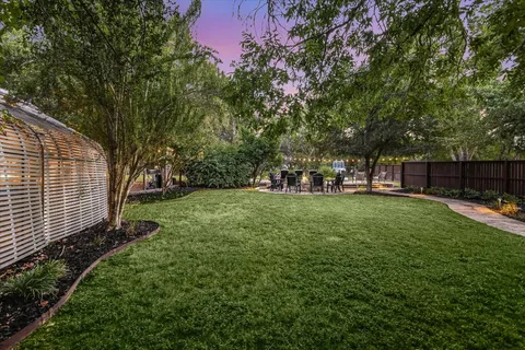 a view of a park with large trees