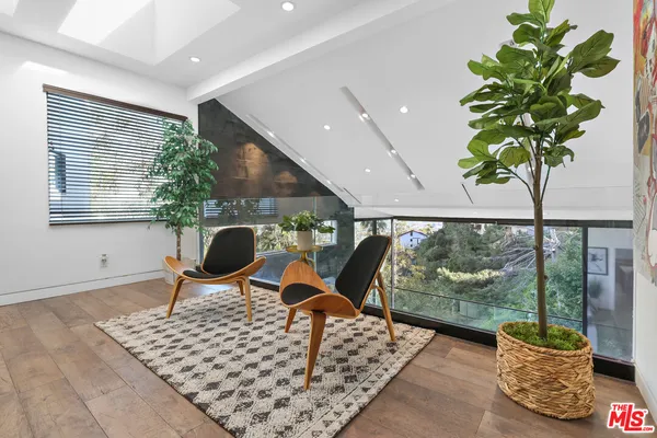 a outdoor dining space with furniture and outdoor view