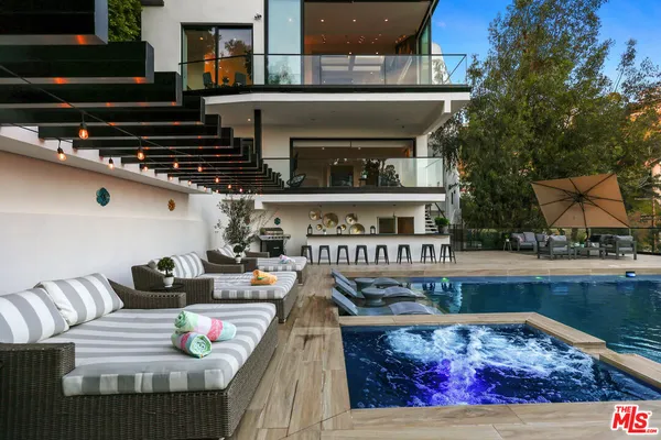a view of a chairs and tables in the balcony