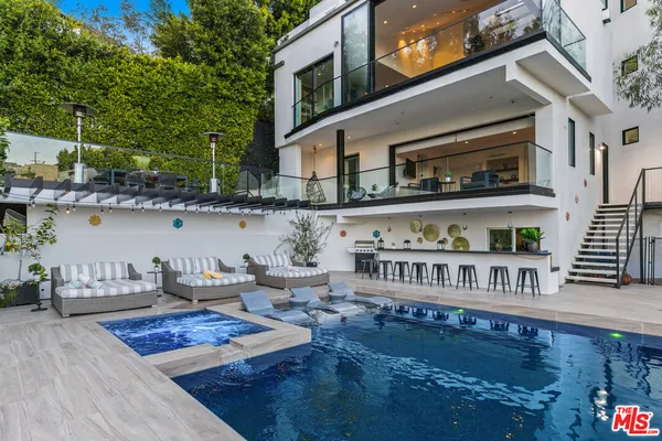 a roof deck view with a sitting space