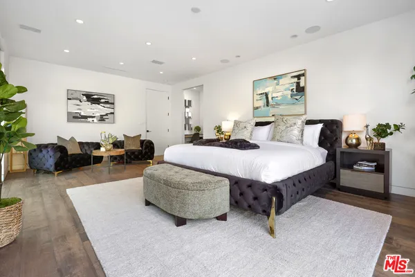 a living room with furniture and a rug