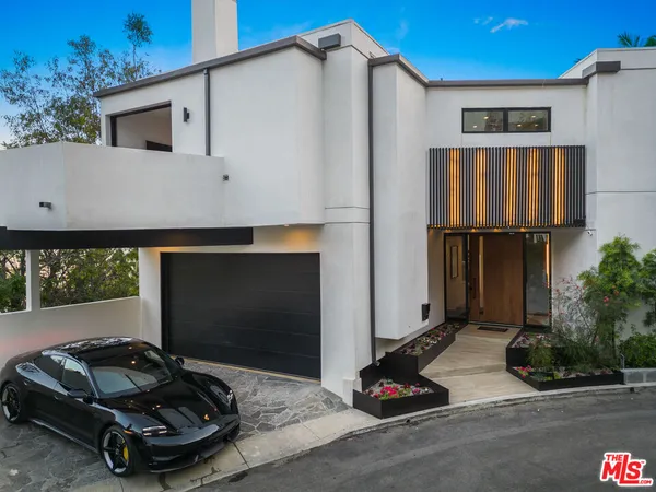 a car parked in front of a house