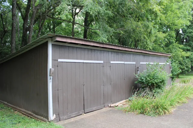 a couple of potted plants in front of door