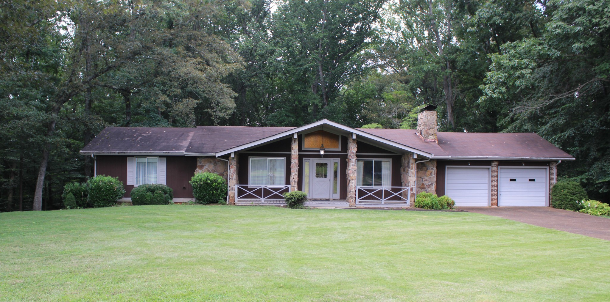 200 Primrose Lane Morrison, TN 37357 - Photo 7 of 53 a front view of a house with garden