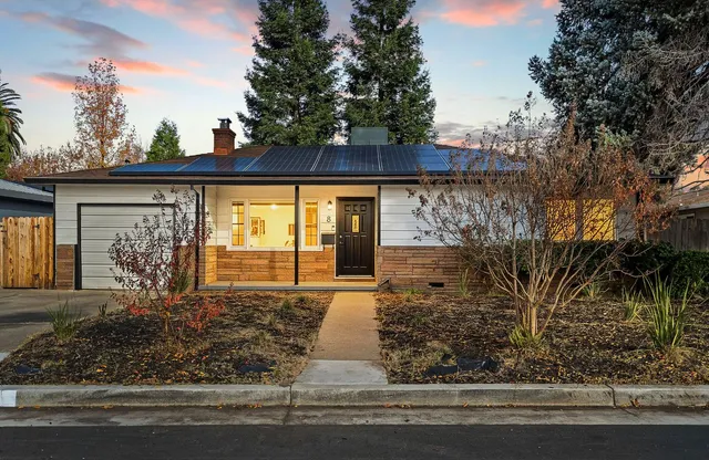 a front view of a house with garden