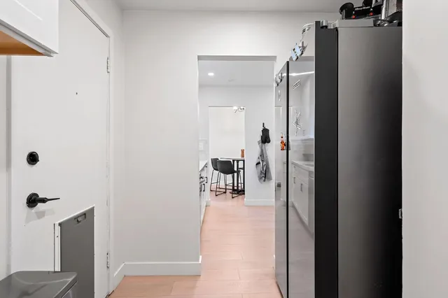 a view of a bathroom from a corridor